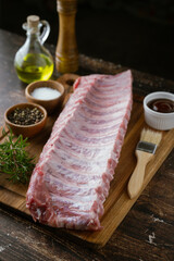 raw pork spare ribs on wooden board