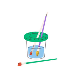 Brushes in cup of water