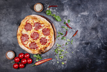 Sliced pizza on dark background - 750968119