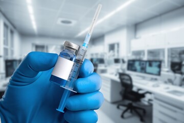 Vaccine in a vial in hands, treatment of infection