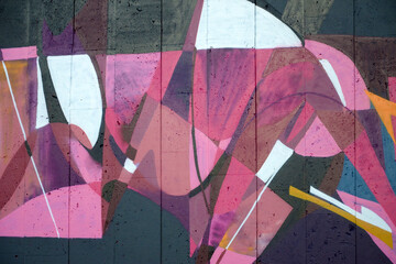 Colorful background of graffiti painting artwork with bright aerosol outlines on wall. Old school...