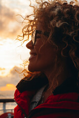 Travel and happiness expression side portrait concept. One woman smiling and enjoying freedom....