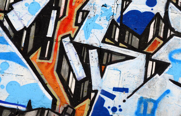 Colorful background of graffiti painting artwork with bright aerosol outlines on wall. Old school...