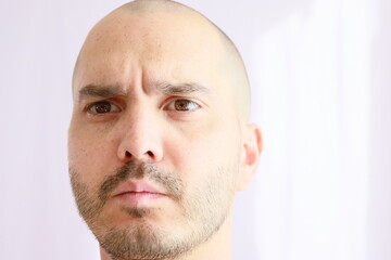expressive average looking bald man 