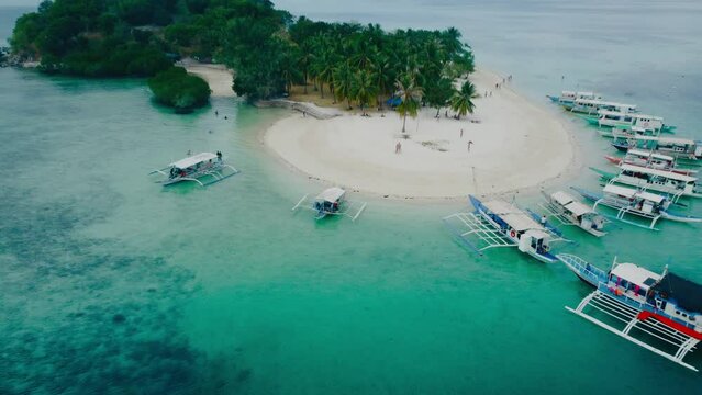 Aerial sky 4k view of Coron Island and Pass Island off the coast of mainland Coron Island , The Philippines. Beautiful scenic tropical beaches, mangroves, and turquoise waters, coconut lined beaches.
