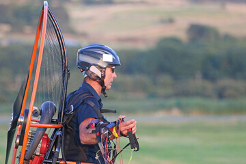 Paramotor pilot preparing to fly	