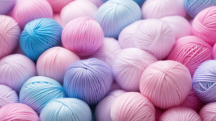 Fototapeta na wymiar Pile of colorful balls of pastel wool in close-up, an assortment of yarn for needlework