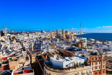 Aerial panoramic view of the old city rooftops and Cathedral de Santa Cruz from tower Tavira in...