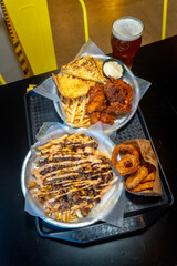 chicken strips onion rings and hamburguer fries