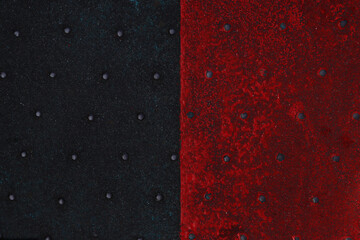 Grunge steel industrial boat floor plate painted red black anti-rust paint. Robust ferry ship metal...