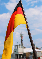 Flag of Germany on the ship waving in the wind over the Constance lake (Bodensee). German national...