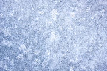 Authentic ice surface, texture of the frozen surface of a lake, river.