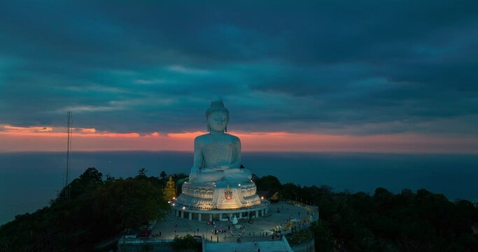 aerial view around Phuket big Buddha in beautiful twilight..360 degree view on Phuket big Buddha viewpoint..Video clips for travel and religious ideas..smooth cloud in dark sky background.