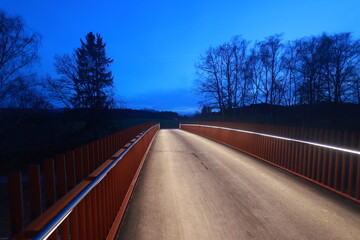 A bridge with a railing on the side of the road - 751005155