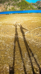 Couple shadow on beach, sunset lighting. Mediterranean Sea, Turkey.