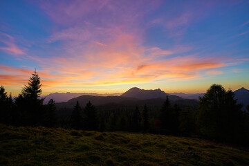 A beautiful sunset in the Alpine mountains. Forest, Alpine peaks, Austria, Europe.