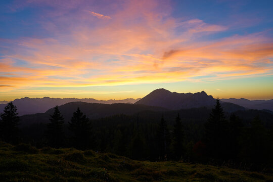 A beautiful sunset in the Alpine mountains. Forest, Alpine peaks, Austria, Europe.