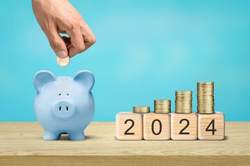 Happy 2024 New Year with blue piggy bank