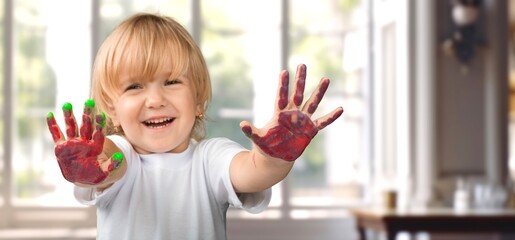 Child drawing Paint on hands do homework from home.