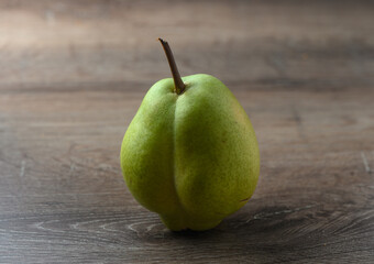 juicy pear on a wooden table 2