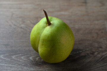 juicy pear on a wooden table 1