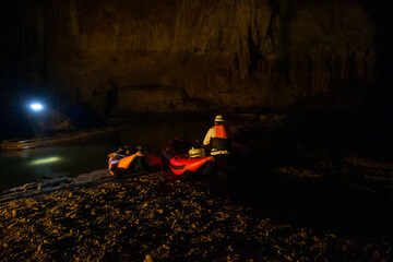 Tourists use a boat to explore Tham Lod, Pai, Mae Hong Son. Tham Lod, one of the most amazing caves in Thailand.