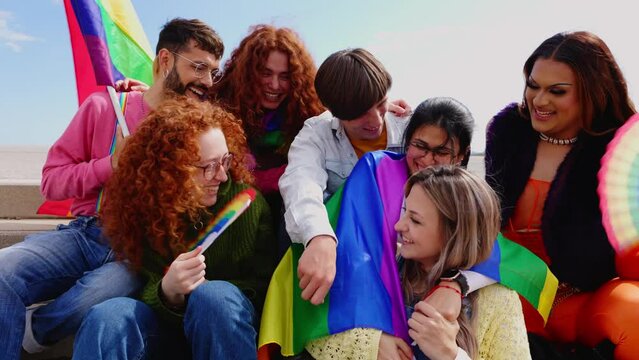 Happy group of gay friends people having fun together celebrating LGBTQ pride festival day. LGBT community concept
