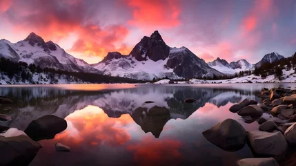 Foto auf Acrylglas Antireflex Panoramic view of snow capped mountains reflected in lake at sunset © Iman