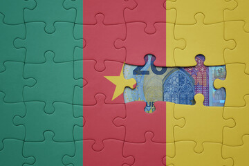 puzzle with the national flag of cameroon and euro banknote. finance concept