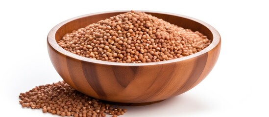 A wooden bowl filled with brown lentils, showcasing its raw and natural form.