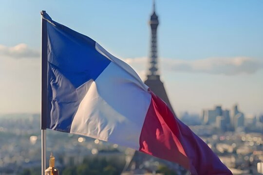 Eiffel Tower with French flag on a sunny day