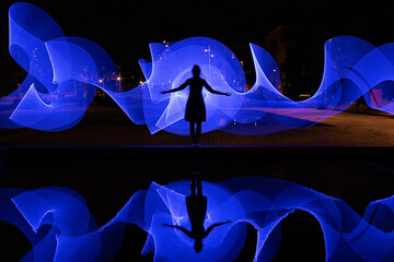 Woman silhouettes with light painting