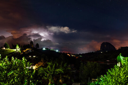 Nature night landscape with Penon Guatape during storm and bolts