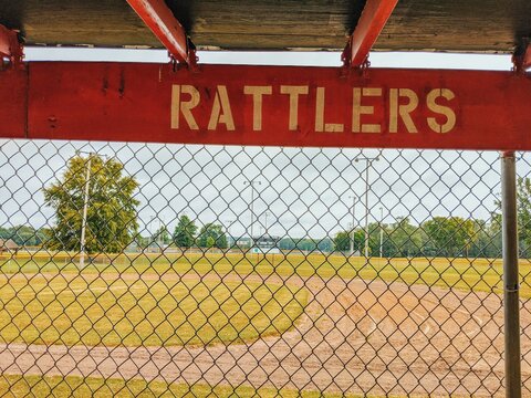 Baseball Dugout POV Looking out into Field with Rattlers Sign