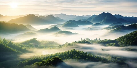 Beautiful green mountain landscape with morning sunrise sky and fog. Aerial view of green trees in tropical mountain forests and fog in winter. - Powered by Adobe