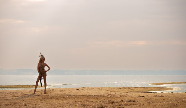 shore landscape with a silhouette of a woman