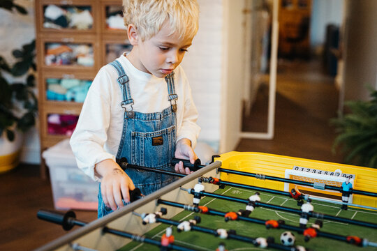 Kid playing Table Football