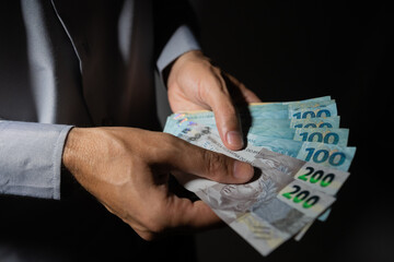 The picture represents cases of corruption and bribery in many different cases such as politics, football, business in Brazil, Europe and the USA. This could be in dollar, euro or brazilian real.