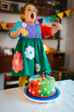 Taking a big breath, ready to blow out birthday candles