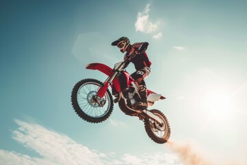 A man pilots a dirt bike by jumping in the air