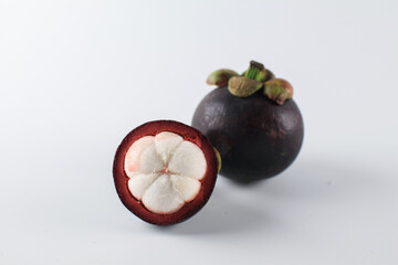 Mangosteen isolated on white background. Known as The Queen of Fruits, asia fruits concept. Sweet tropical fruit.
