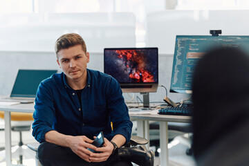 Programming. Man Working On Computer In IT Office, Sitting At Desk Writing Codes. Programmer Typing...