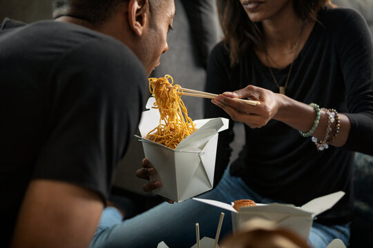 Loft: Woman Eating Lo Mein From Takeout Box