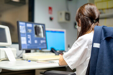 Medical practitioner browsing scan on computer