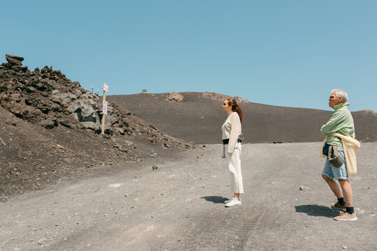 Tourists in volcanic natural Park in Mount Etna