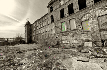 Derelict Victorian mill, built with Yorkshire stone, near, Canal Road, where textile mills flourished in what is now the, post industrial city of, Bradford, Yorkshire, UK (Sepia Version)