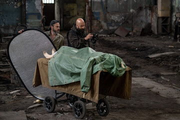 cameraman and assistant working on horror filming