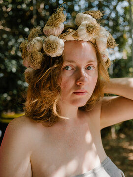 Girl with a garlic wreath 