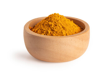 Indian spice. Turmeric powder in a wooden bowl on white - 751046178