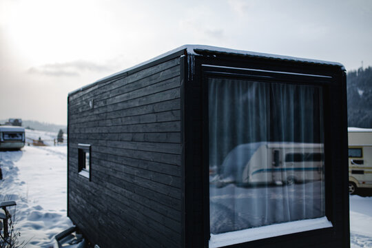Winter Tiny house with huge window.
